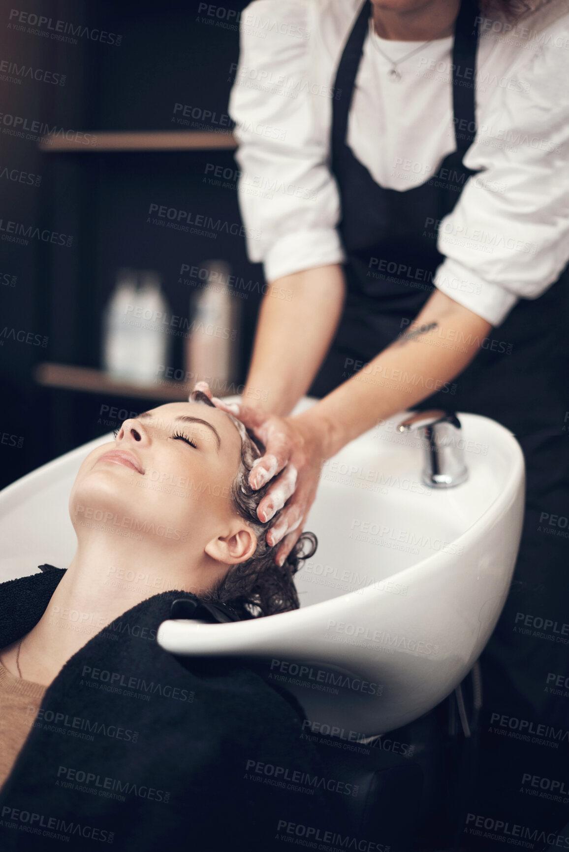 Buy stock photo Soap, massage and hairdresser with client in spa, relax and basin for wash and treatment. Hands, salon and hairstyle or balayage dye for happy customer person, keratin or scalp shampoo for hair care