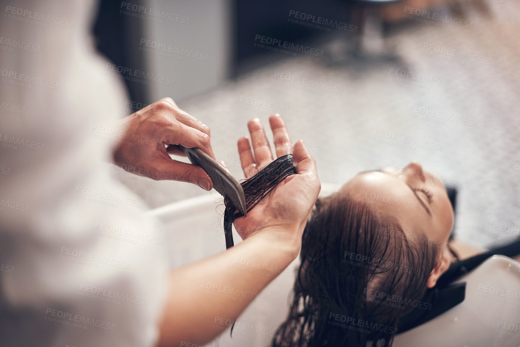 Buy stock photo Hands, hairdresser and comb hair of customer for keratin treatment, haircare and professional cut for hairstyle. Beauty salon, cosmetologist and hairstylist with client for grooming, service and care