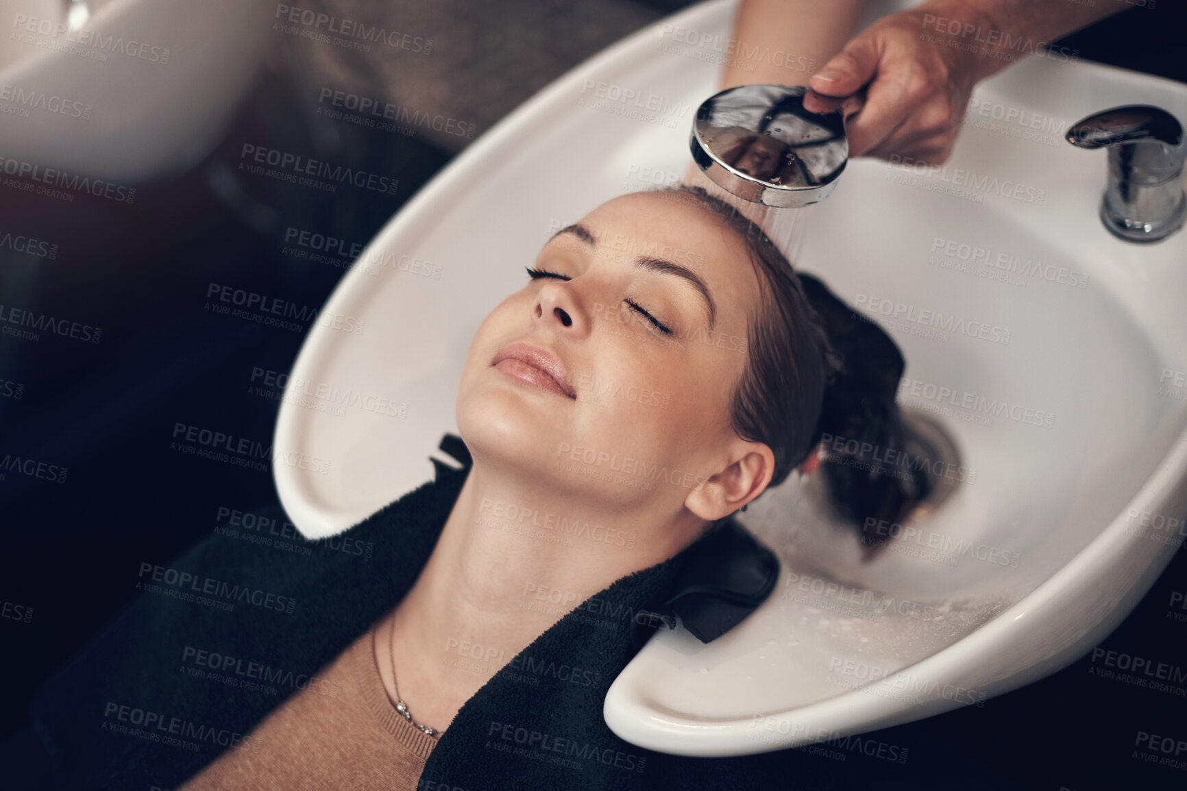 Buy stock photo Washing hair, woman or hands of stylist with customer in salon or basin for cleaning treatment. Rinse, scalp and grooming service for client, person or shampoo cosmetics for beauty, wellness or spa