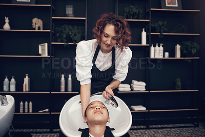 Buy stock photo Washing, child or hairdresser with client in salon or basin for scalp, care and cleaning treatment. Rinse, girl or grooming service for customer or shampoo cosmetics for beauty, wellness and spa 