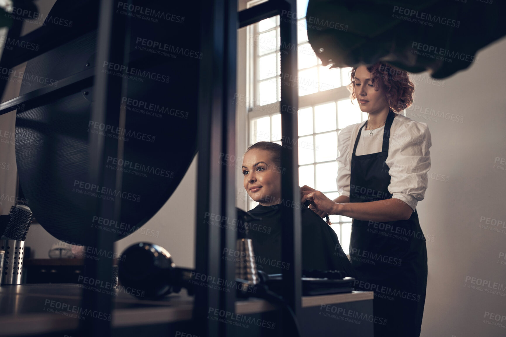 Buy stock photo Woman, hairdresser and comb hair of customer for keratin treatment, haircare and professional cut for hairstyle. Beauty salon, cosmetologist and hairstylist with client for grooming, service and care