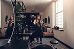 Shot of a hairstylist cutting a client's hair in a salon