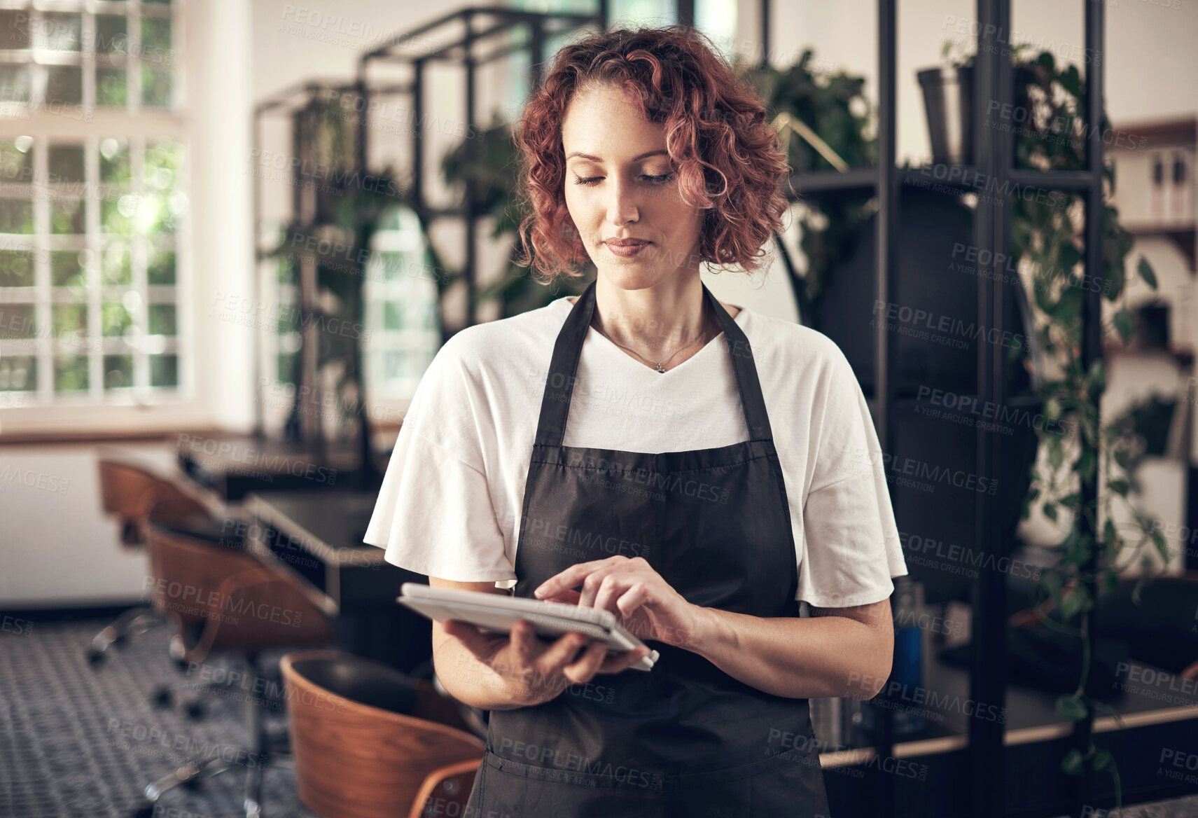 Buy stock photo Beauty, work and woman with tablet in hair salon for job,  planning and reading online appointment. Small business, stylist and person with tech in spa for client booking, portfolio and information