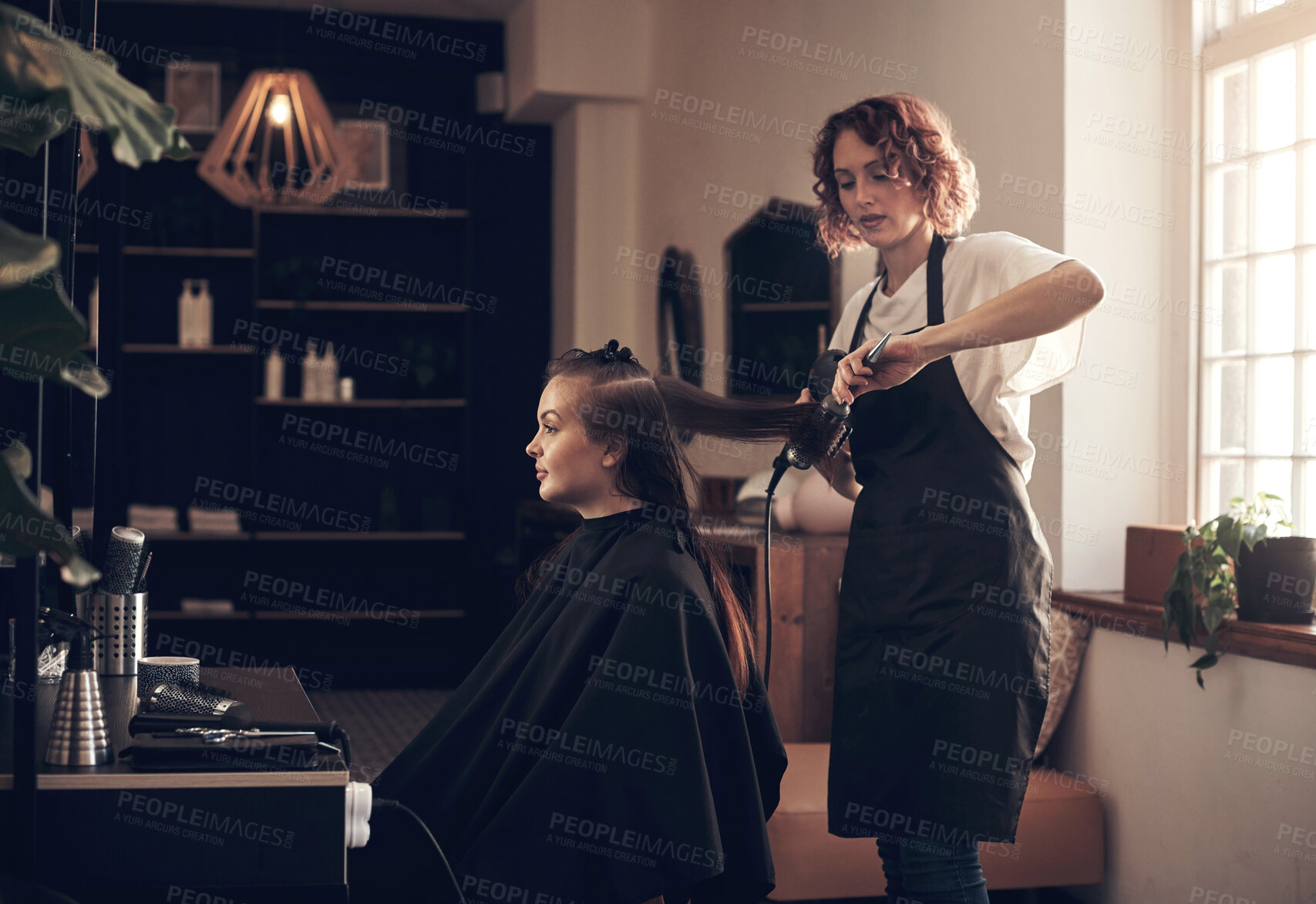 Buy stock photo Woman, hairdresser and client with hairdryer at salon for heat treatment, maintenance and haircare of change. People, designer and tools for consultation session, blowout and style at luxury service