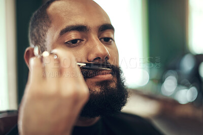 Buy stock photo Beard, moustache and man at barbershop with scissors, haircut trim and relax in customer service at small business. Tools, barber and face of client in chair for grooming, style and facial hair care