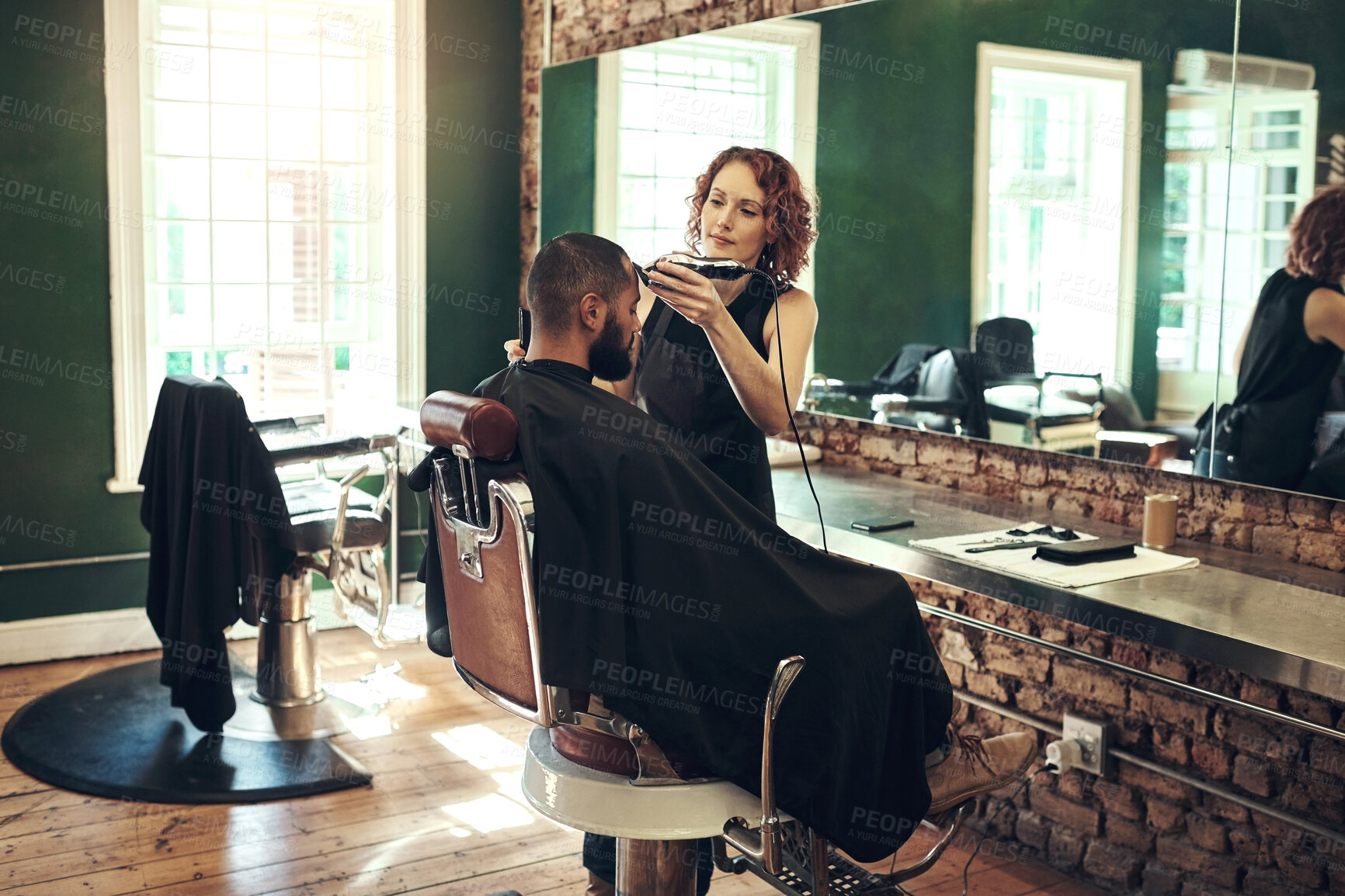 Buy stock photo Barber, shaving and hairdresser with man for grooming service, wellness and trim in boutique. Hair salon, barbershop and woman with electric shaver for client for appointment, treatment and hairstyle