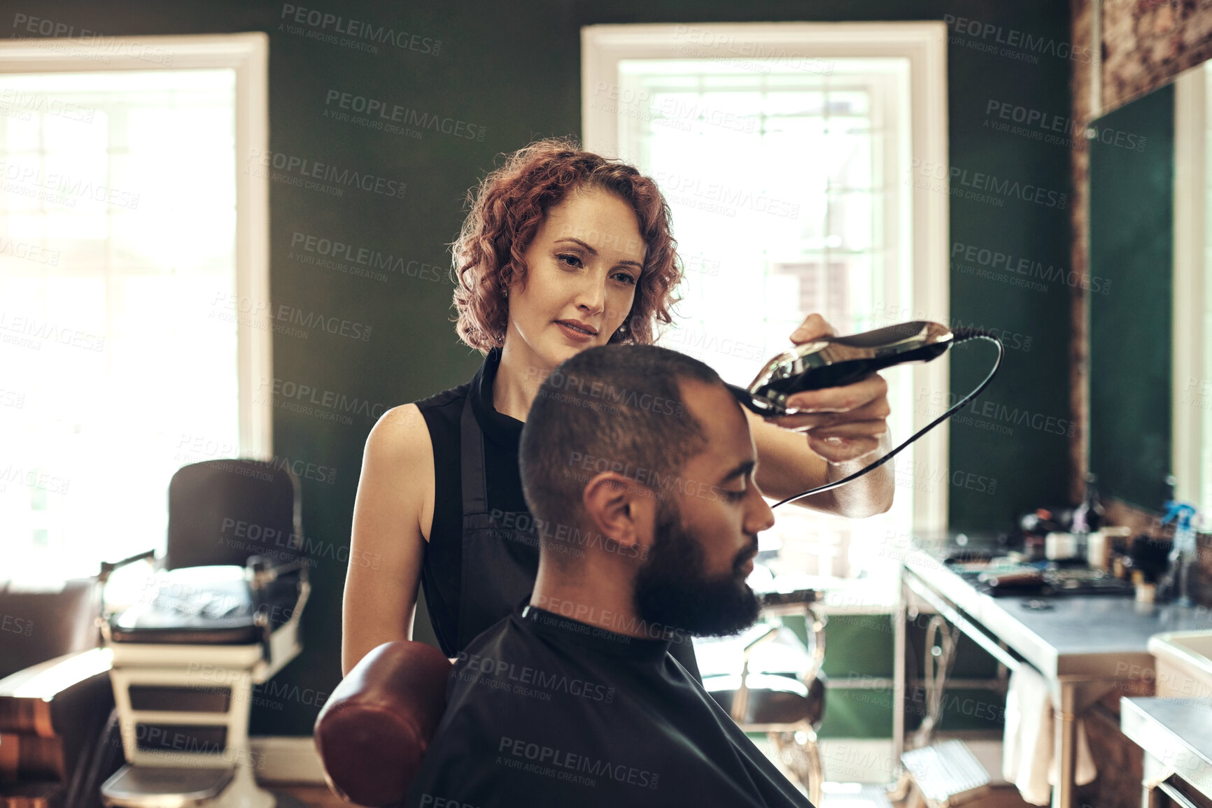 Buy stock photo Barber, shave and hairdresser with man for grooming service, wellness and trim in boutique. Hair care, barbershop and woman with shaving tool for customer for appointment, treatment and hairstyle