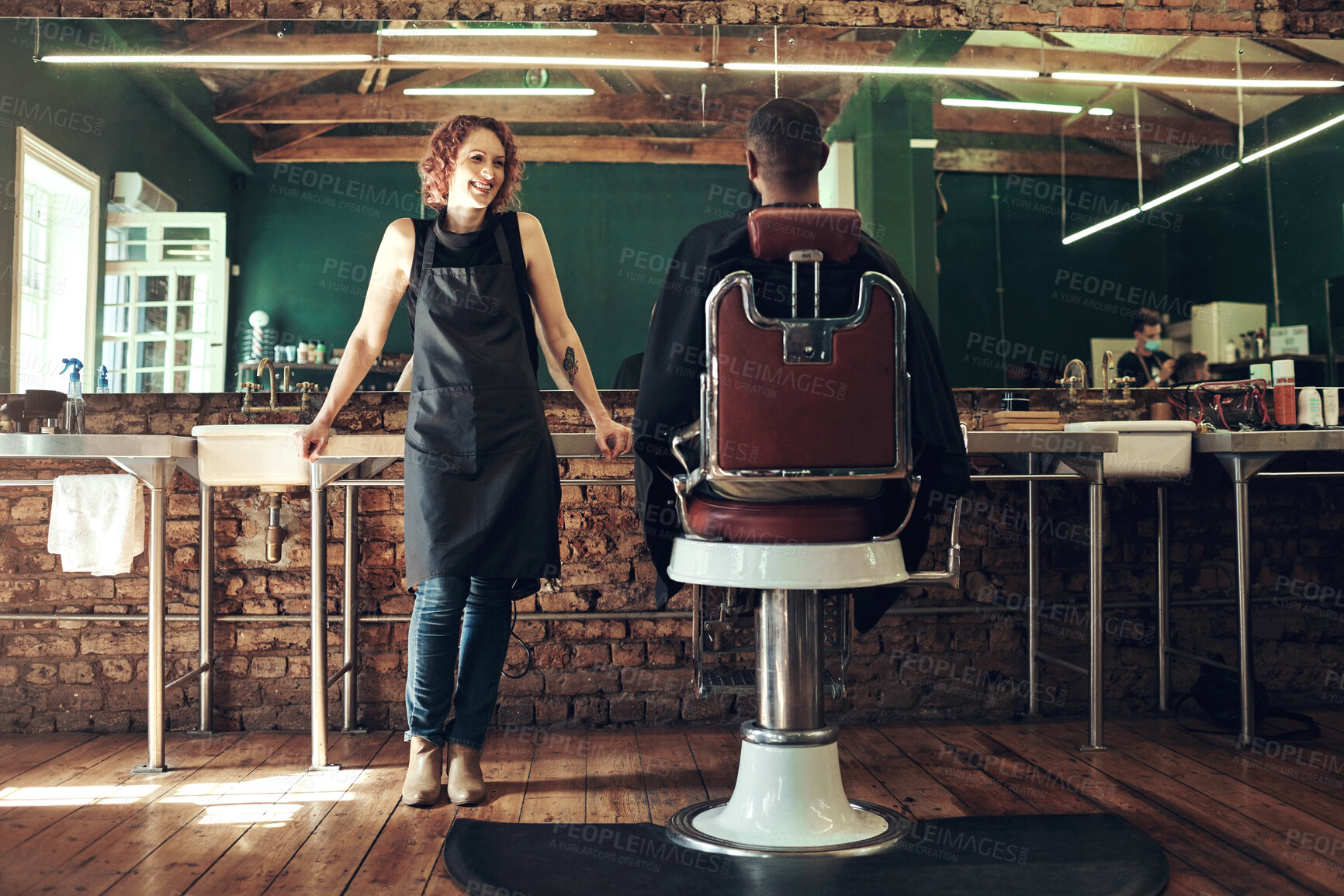 Buy stock photo Full length shot of an attractive young hairdresser standing and talking to a client in her salon