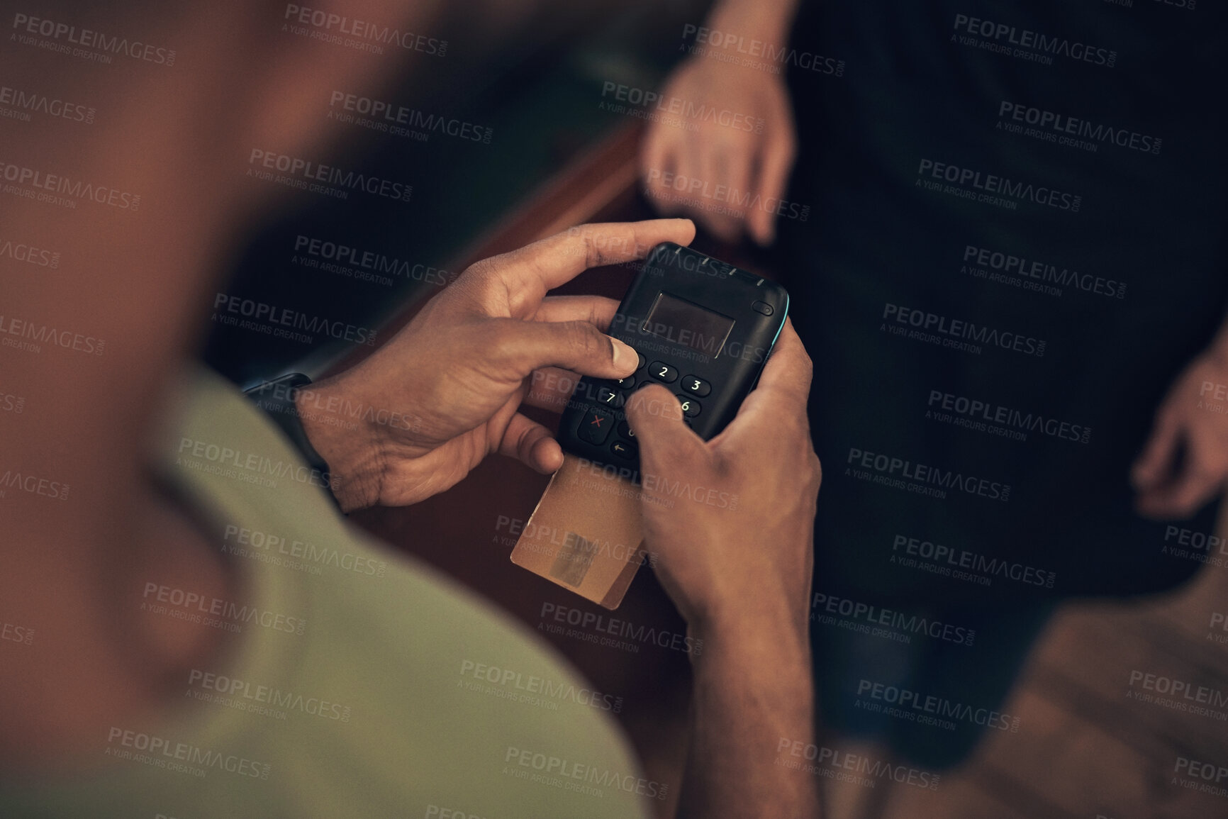 Buy stock photo Cropped shot of an unrecognisable man using a card machine to pay his hairdresser in the salon