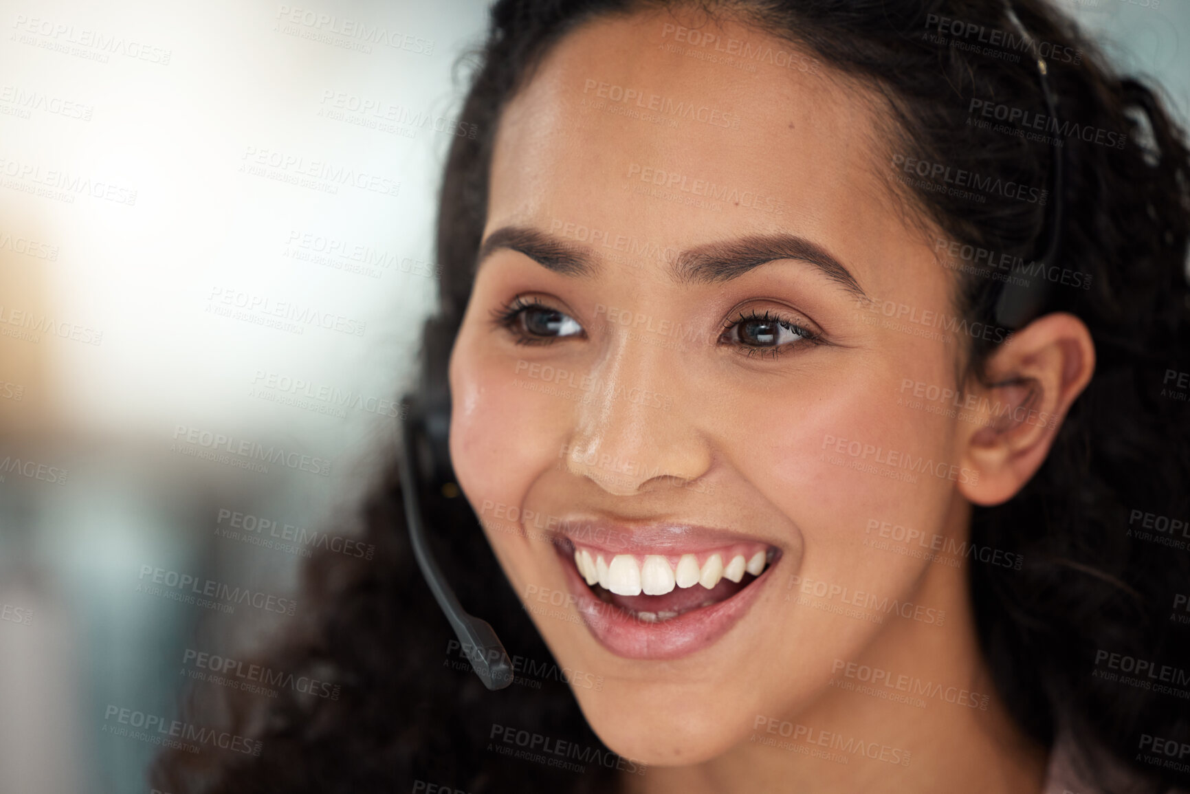 Buy stock photo Shot of a young call centre agent working in an office