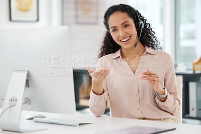 Buy stock photo Shot of a young call centre agent working on a computer in an office