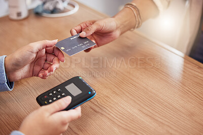 Buy stock photo Shot of a retail employee accepting payment from a customer