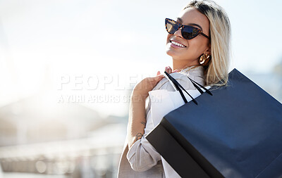 Buy stock photo Shot of a beautiful young woman enjoying a day of shopping