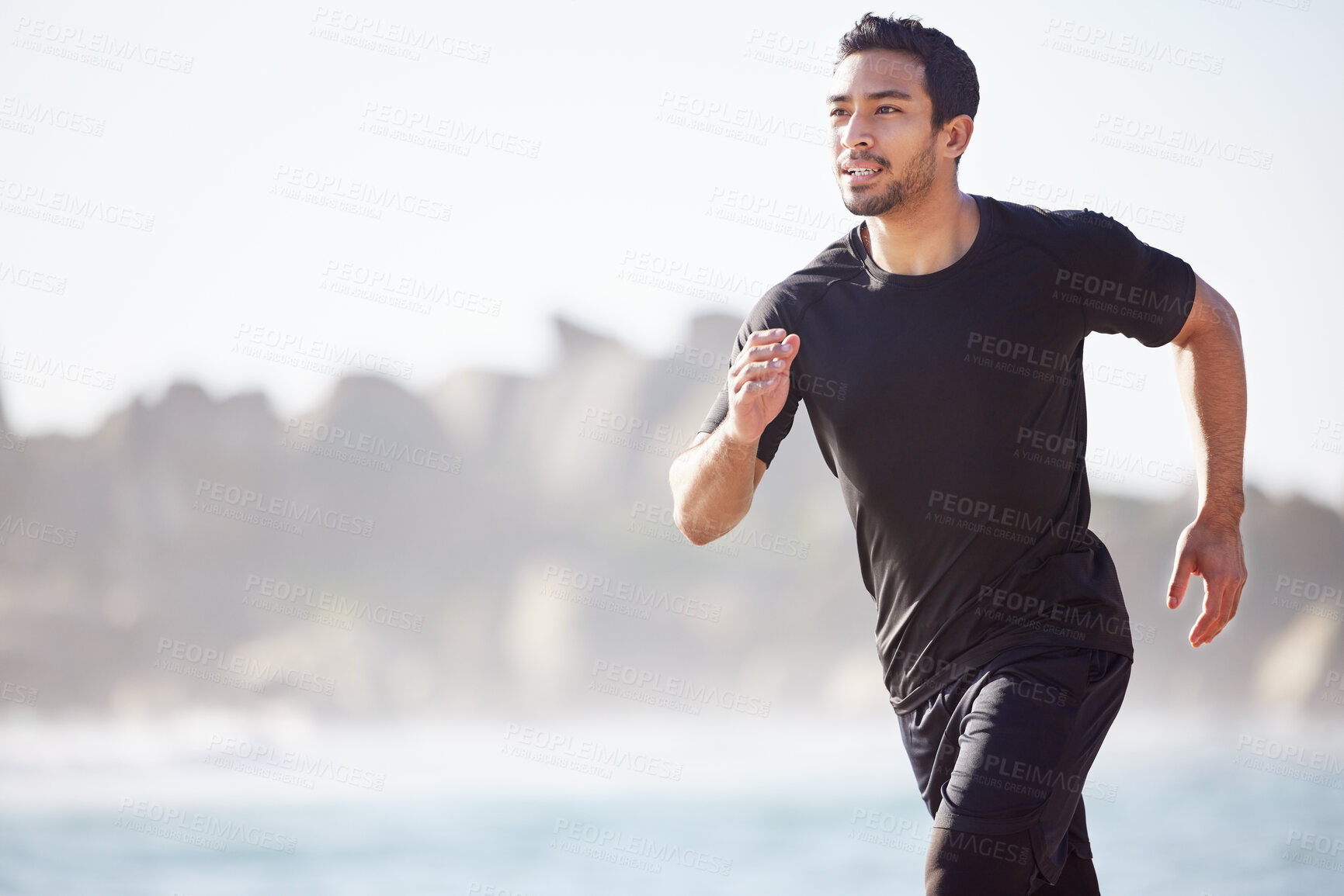 Buy stock photo Man, running and exercise on beach in summer for fitness and training in cardio for wellness. Athlete, workout and healthy journey outdoor at ocean or sea with runner on promenade in sunshine