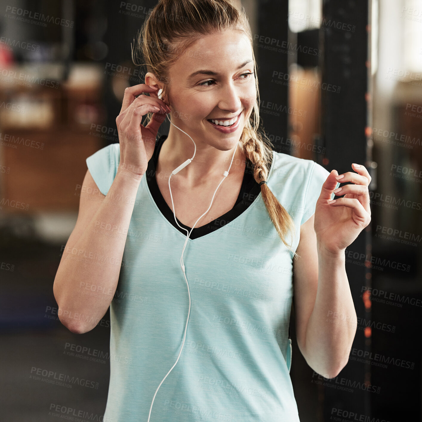Buy stock photo Woman, earphones and exercise music in gym or fitness podcast for performance, training or streaming. Female person, smile and online playlist for workout athlete or routine, challenge or internet