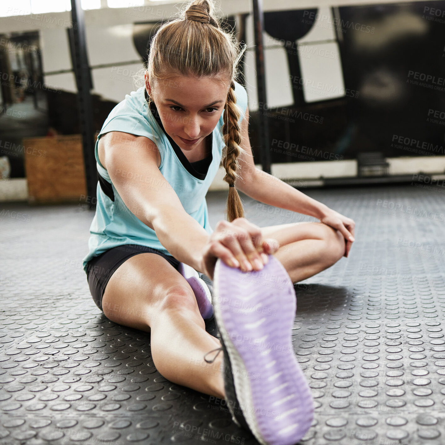 Buy stock photo Stretching, warm up and woman in gym for exercise, training and fitness on floor for workout. Health, sports and female person stretch legs in sport center for wellness, performance and flexibility