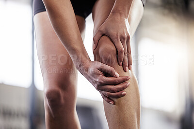 Buy stock photo Shot of a young woman suffering from an injury while at the gym