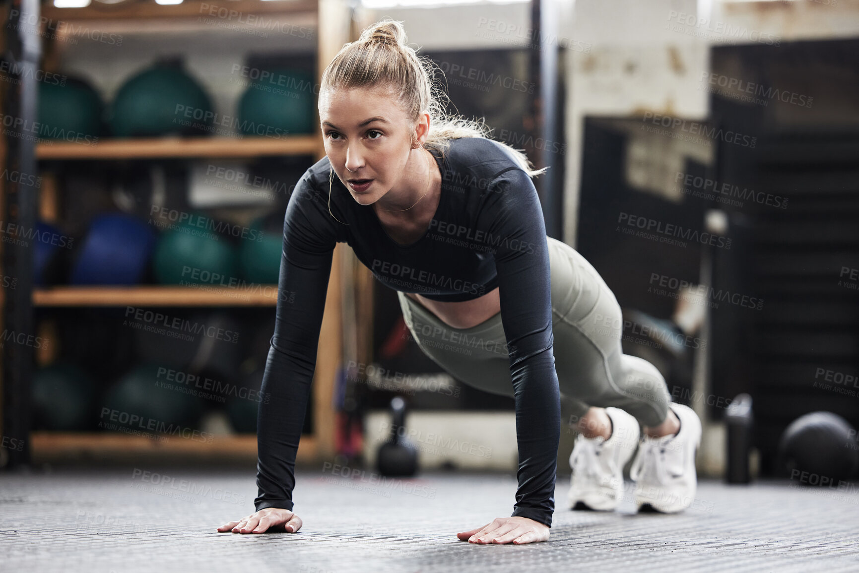 Buy stock photo Fitness, push up and woman in gym for exercise, bodybuilder training and strong muscles. Healthy body, sports center and female person do pushup on floor for wellness, performance and cardio workout