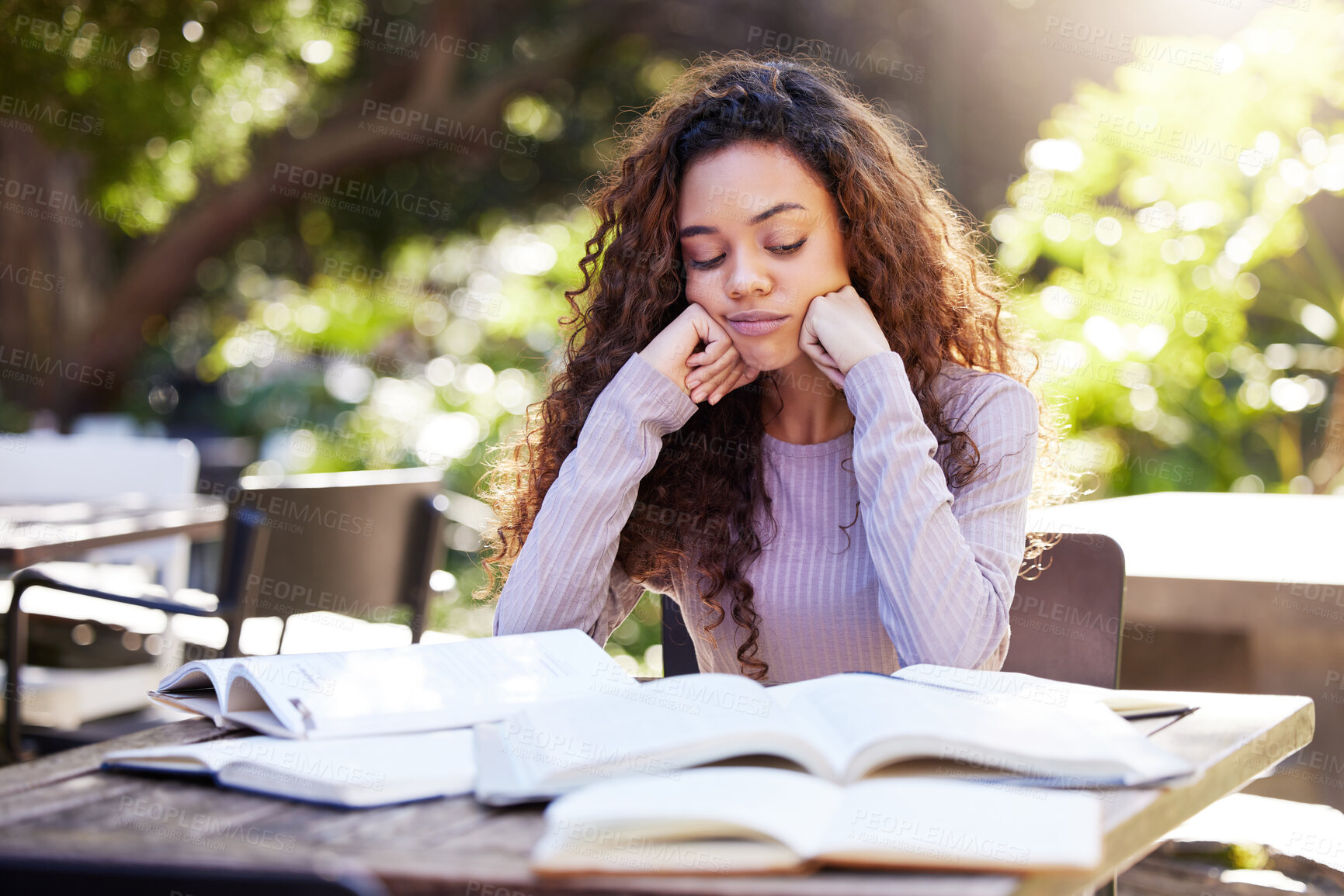 Buy stock photo Tired, woman and study books in college, education and learning at outdoor, cafe or working on park table on campus. Girl, studying and university student to work, learn or research from reading