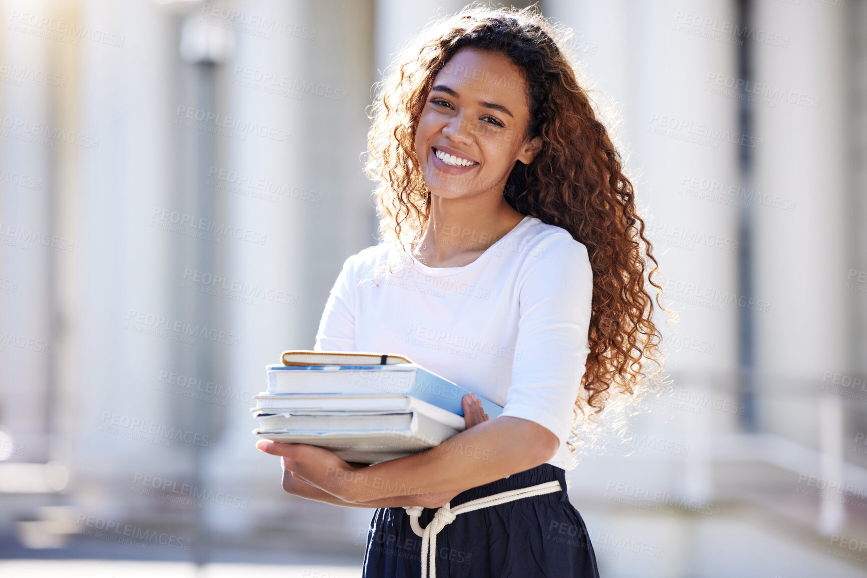 Buy stock photo College student, woman and books in portrait, outdoor and happy for research, studying and education at academy. Girl, person and smile with textbook, scholarship and learning at university campus