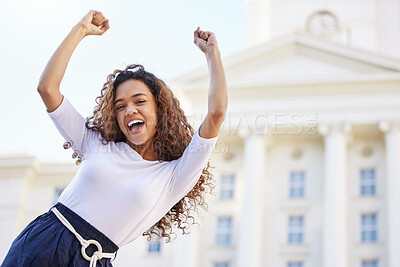 Buy stock photo Shot of a young woman celebrating outside