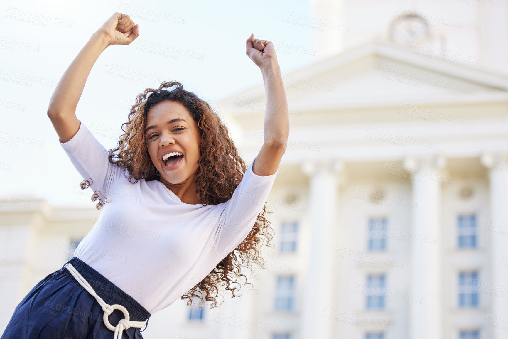 Buy stock photo Shot of a young woman celebrating outside