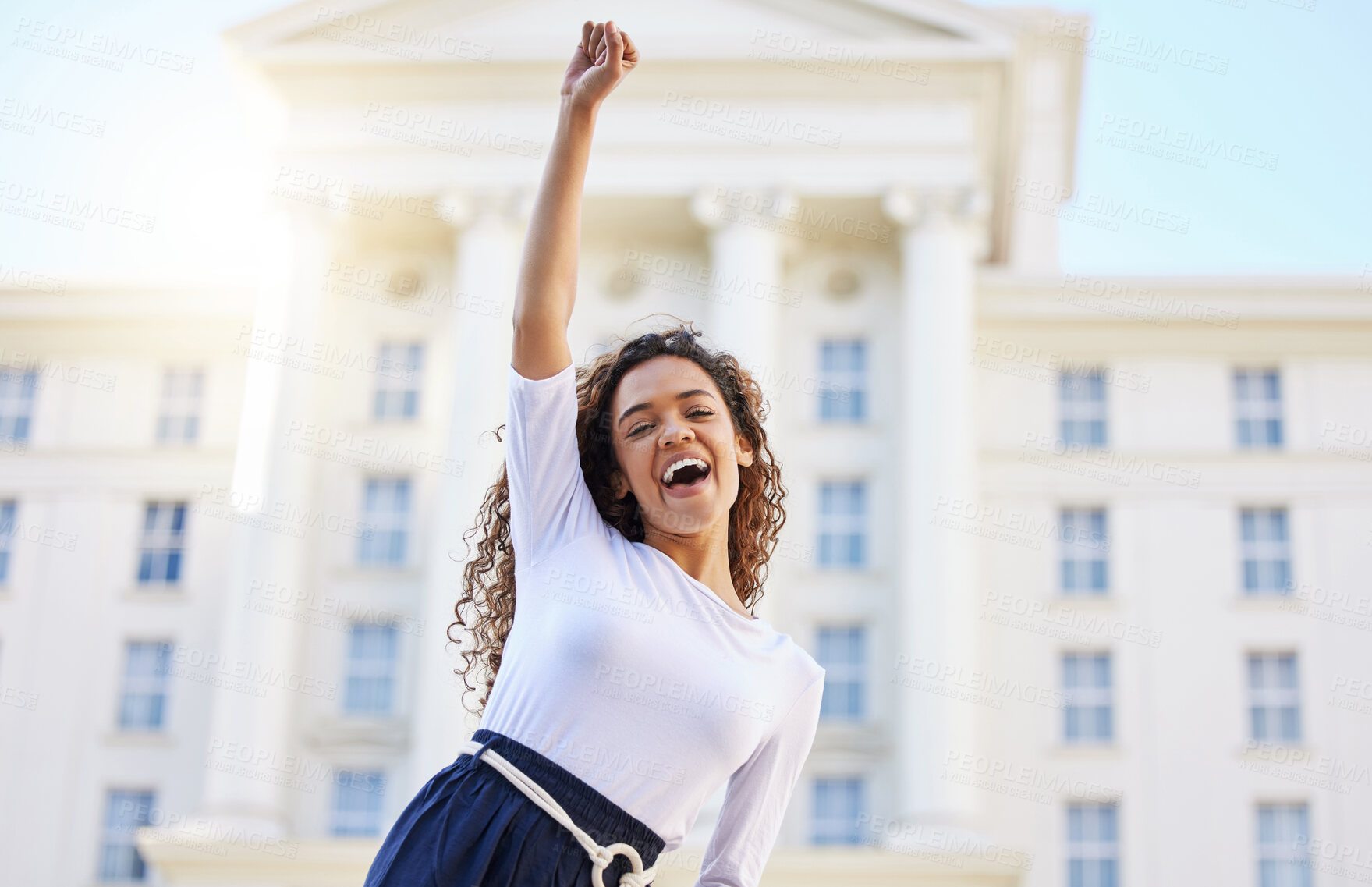 Buy stock photo Shot of a young woman celebrating outside