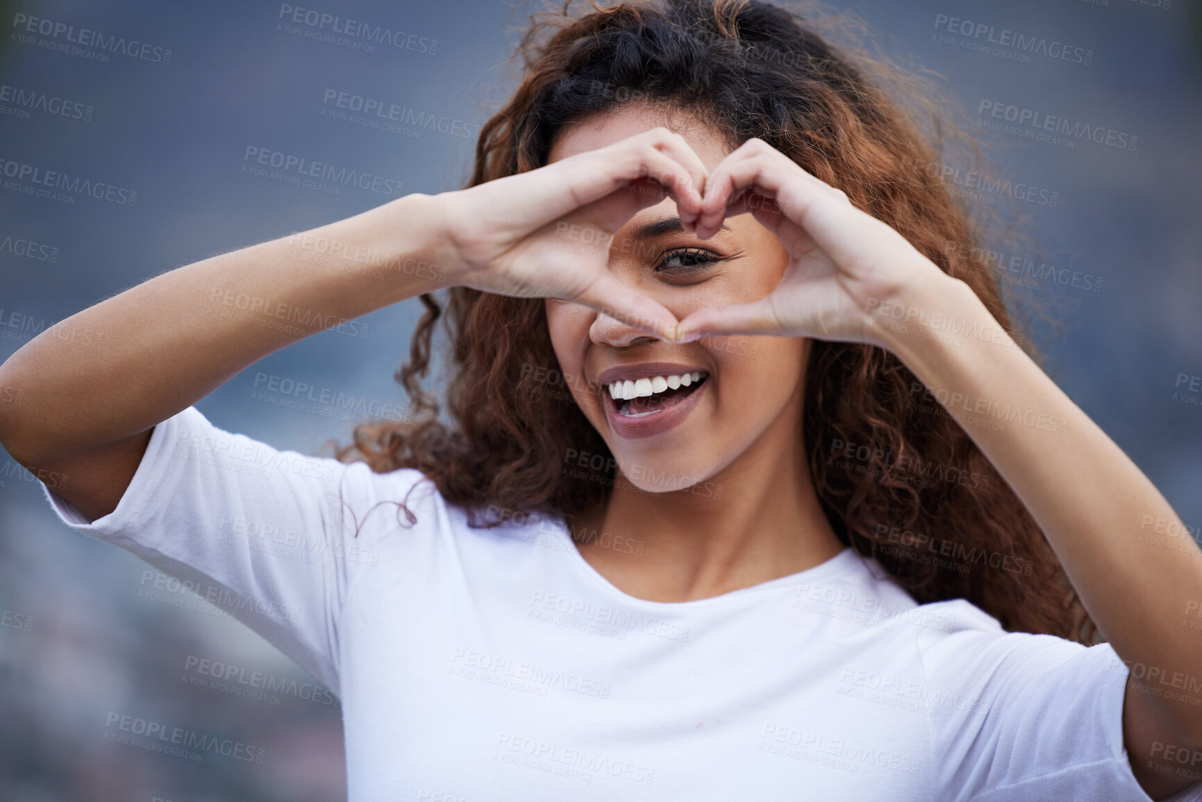 Buy stock photo Heart, hands and portrait of happy woman outdoor for travel, adventure and fun with gesture of care. Emoji, frame and gen z girl with love sign for thank you, support or London immigration experience