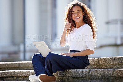 Buy stock photo Shot of a young woman using a laptop on the steps at college