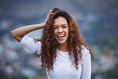 Buy stock photo Cropped portrait of an attractive young woman out for an early morning hike in the mountains