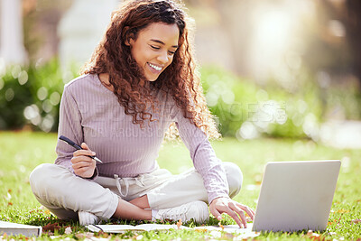 Buy stock photo Woman sitting on lawn, laptop and college student on campus, studying with course material and education. Happy female person outdoor, learning and study online notes on pc with academic scholarship