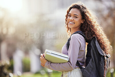 Buy stock photo Shot of a young female student studying in nature