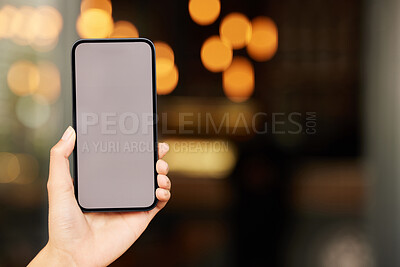 Buy stock photo Shot of an unrecognizable person using a phone against a bright background