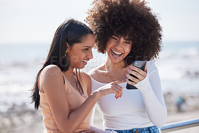 Buy stock photo Girl friends, phone and laugh by the sea with text and meme on holiday with student travel in Miami. Mobile, app and gossip with funny women by the ocean online on the internet together in summer