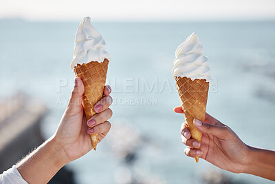 Buy stock photo Women, ice cream and hands at a beach on summer holiday with dessert and sweet treat. Vanilla, friends and ocean with eating together on vacation in Miami with food in the sun with snack by the sea