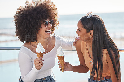 Buy stock photo Women, ice cream and laughing at a beach on summer holiday with dessert and food. Joke, girl friends and ocean with eating together on vacation in Miami with travel in the sun with snack by the sea