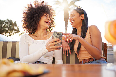 Buy stock photo Laughing, happy and women with a phone at a cafe for a meme or social media notification. Smile, talking and friends with a mobile for a funny app, comic conversation or comedy together at restaurant