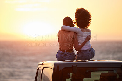 Buy stock photo Love, gay and sunset with lesbian couple on car beach for relax, romance and sky mockup space. Lgbtq, freedom and pride with women hugging on nature date for partner, trust and summer vacation