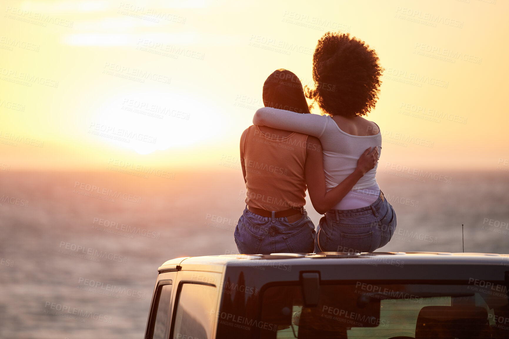 Buy stock photo Love, gay and sunset with lesbian couple on car beach for relax, romance and sky mockup space. Lgbtq, freedom and pride with women hugging on nature date for partner, trust and summer vacation