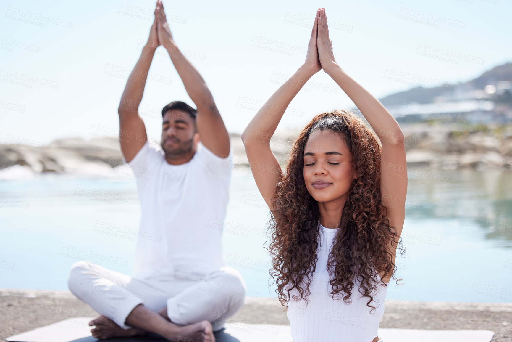 Buy stock photo Meditation, beach and couple with prayer hands for spiritual fitness, mental wellness and namaste. Ocean, pilates and yogi woman with man with eyes closed for zen mindfulness, balanced chi or relax