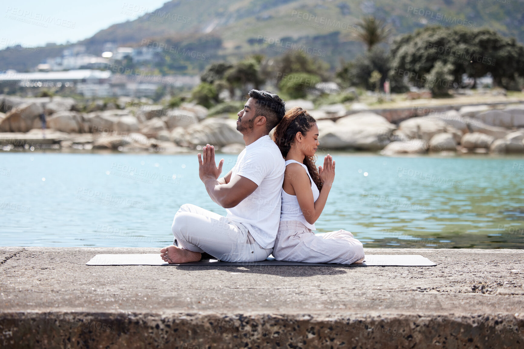 Buy stock photo Meditation, beach and couple with prayer hands for wellness, spiritual health and namaste. Profile, pilates and yogi woman with man with eyes closed for zen mindfulness, balanced chi or relax at sea