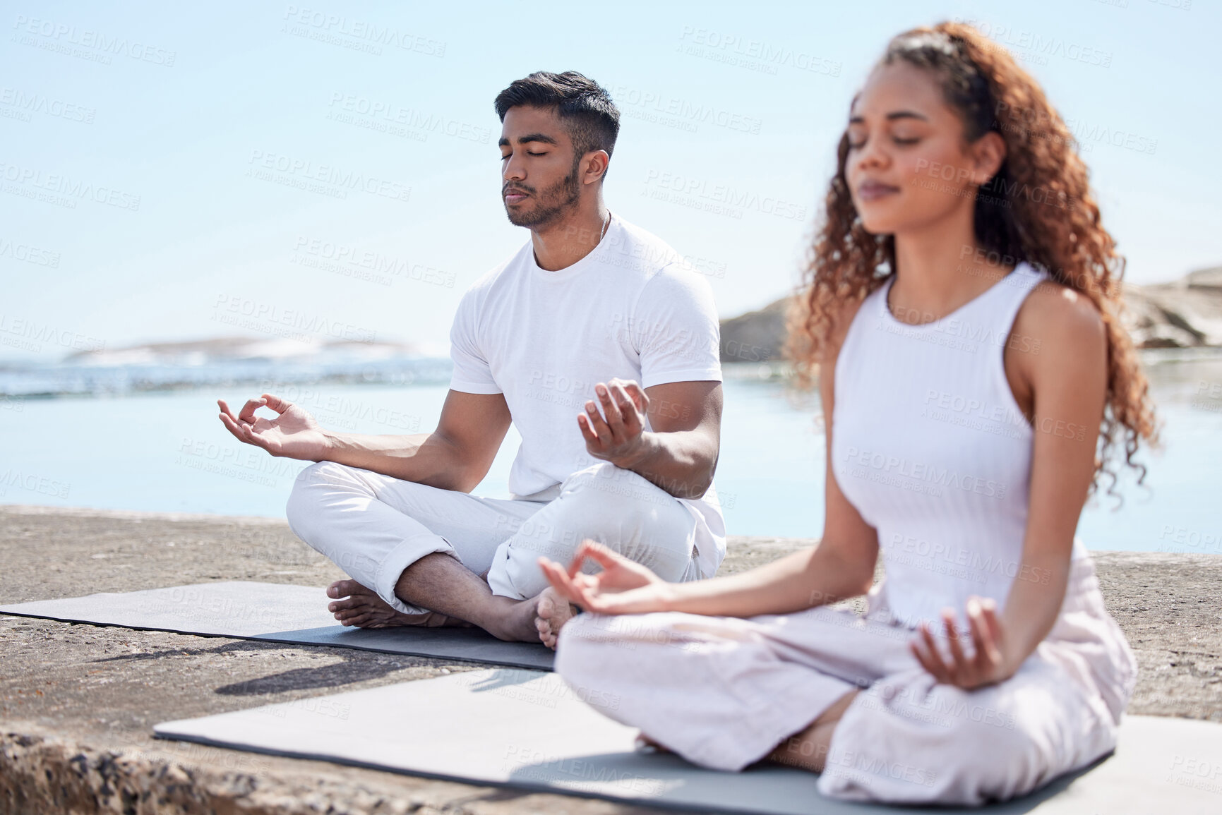 Buy stock photo Couple, man and woman in beach for meditation, mindfulness and holistic wellness outdoor. People, guy and lady with zen for bonding in California to relax, peace and mental health in relationship