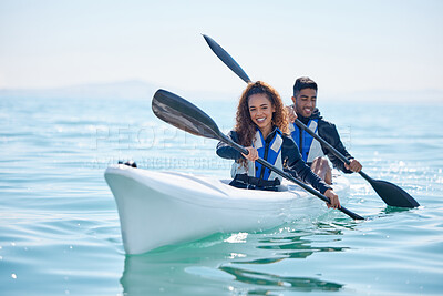 Buy stock photo Portrait of a young couple kayaking together at a lake
