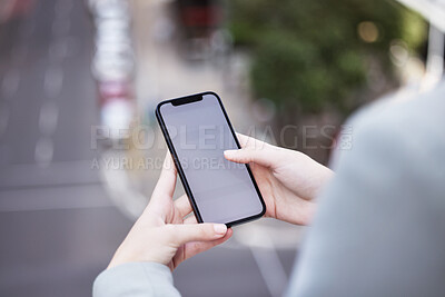 Buy stock photo Cropped shot of an unrecognizable businessman using his cellphone outside