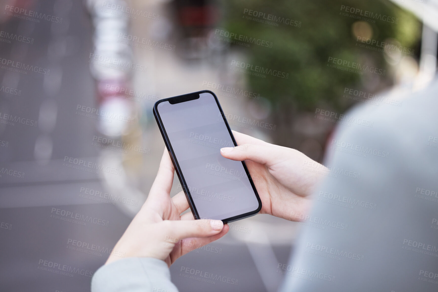 Buy stock photo Cropped shot of an unrecognizable businessman using his cellphone outside