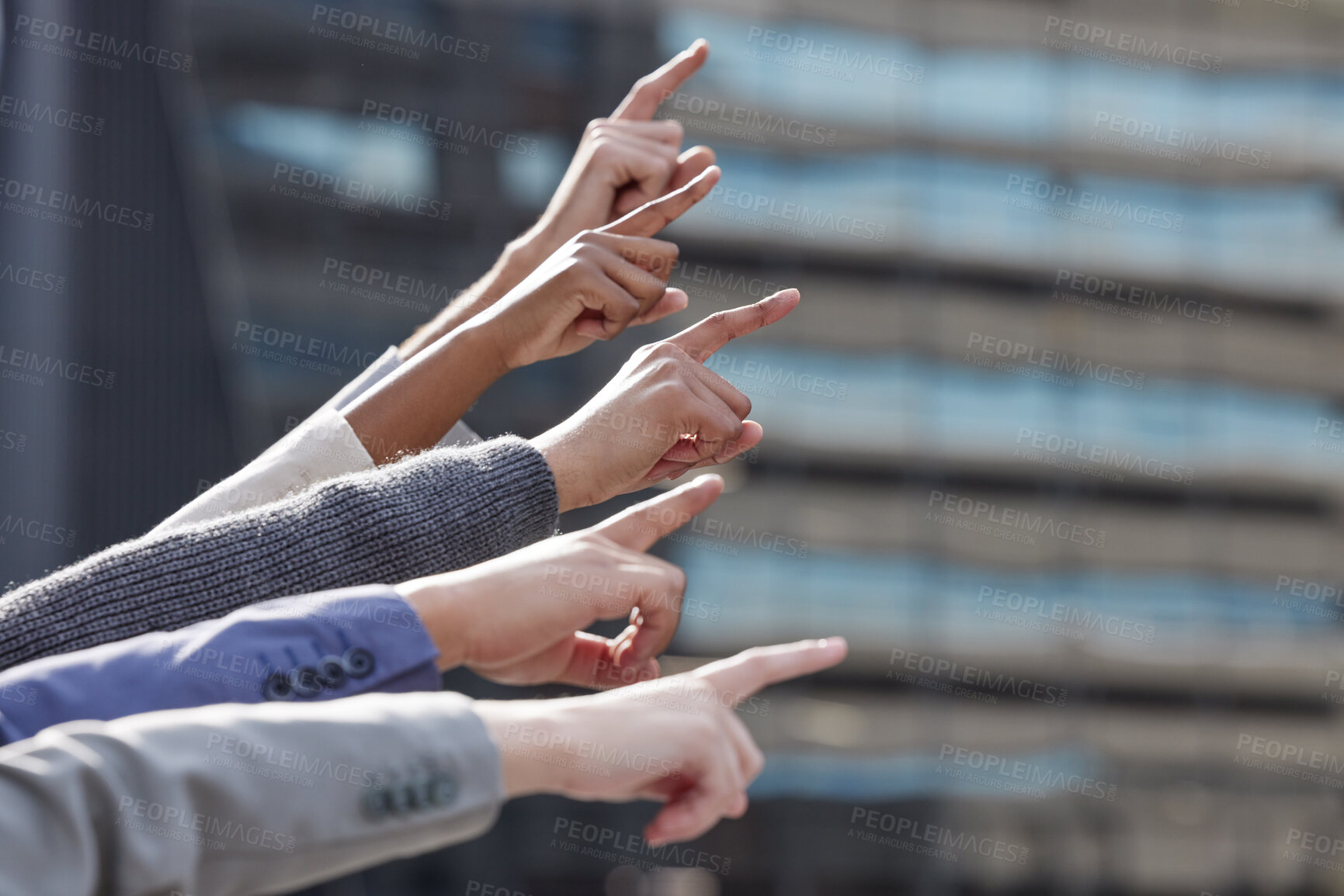Buy stock photo Business, diversity and people with hands pointing, direction and outdoor or building development idea and together. Collaboration, team and company employees, support and mission or finger gesture