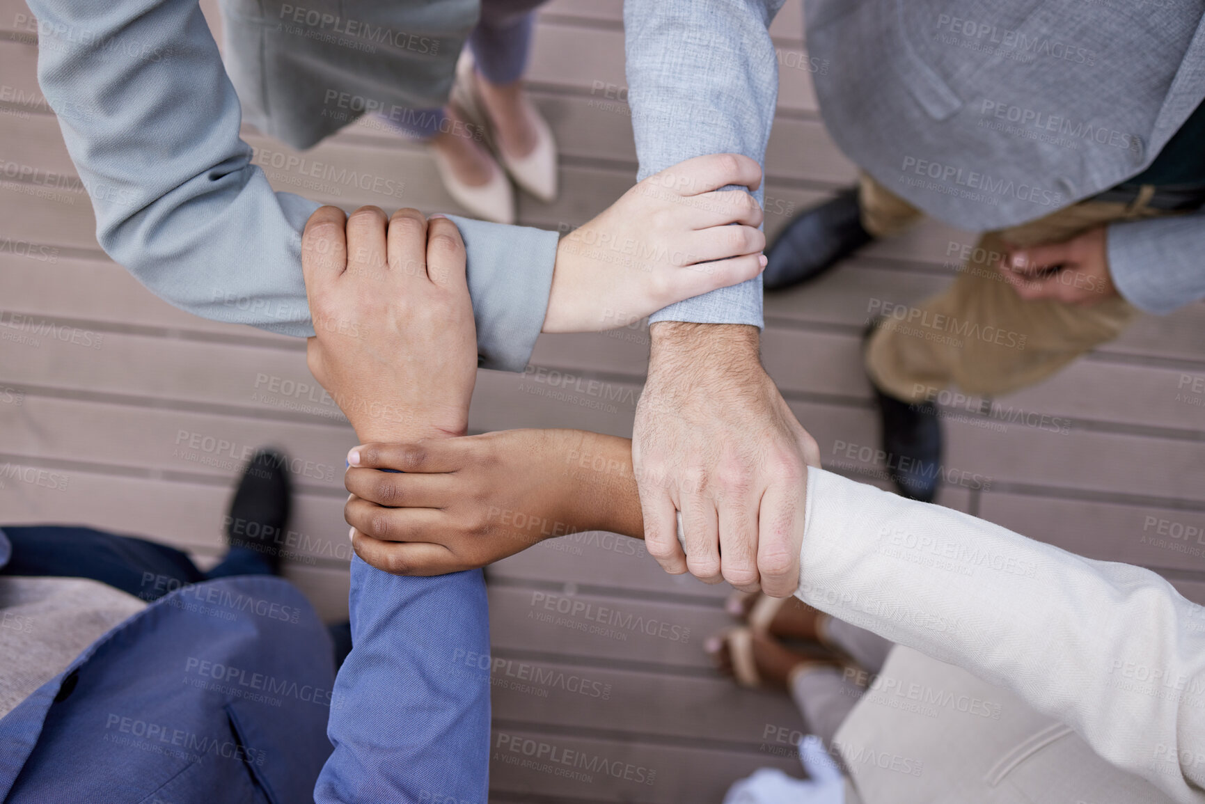 Buy stock photo Business people, hands and arms with connect for synergy or teamwork with team huddle in outdoors above. Goal, partnership and collaboration with diverse group or employees with commitment for goals.