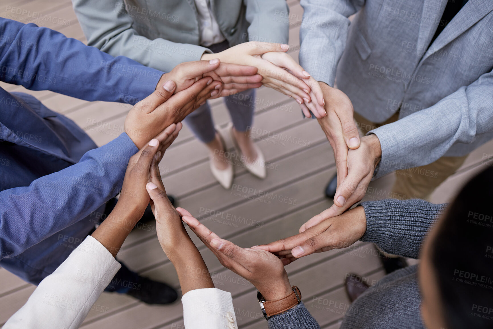 Buy stock photo Shot of a group of unrecognizable businesspeople forming a circle with their hands outside