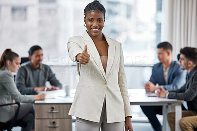 Buy stock photo Shot of a young businesswoman showing a thumbs up while in a meeting at work