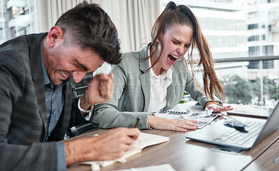 Buy stock photo Shot of two businesspeople looking very upset in an office at work
